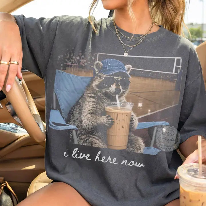 PRE-ORDER - “I Live Here Now” Volleyball Raccoon Graphic Tee